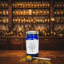 Load image into Gallery viewer, Blue jar of ginger root powder with a spoonful of powder on a patterned background