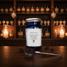 Load image into Gallery viewer, Jar of hibiscus flowers with a label on a textured surface