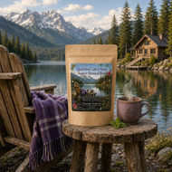 Package of 'Quiet Mind Calm & Stress Support Botanical Blend' with a steaming mug on a wooden stool by a lake with mountains in the background.